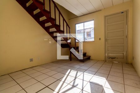 Sala de casa de condomínio à venda com 2 quartos, 80m² em Vila Nova, Porto Alegre
