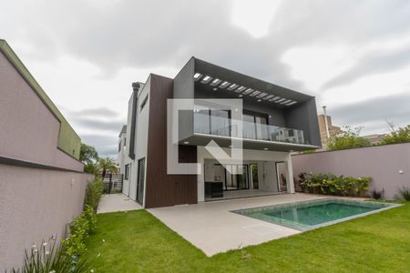 Casa de condomínio à venda com 440m², 4 quartos e 4 vagasQuintal