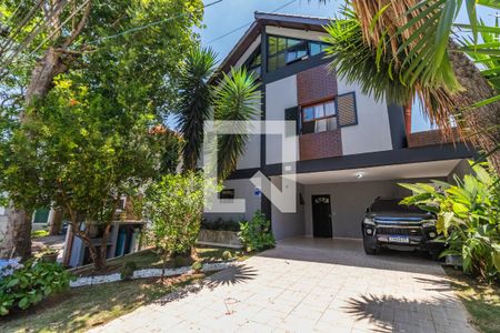 Casa de condomínio à venda com 408m², 4 quartos e 4 vagasFachada