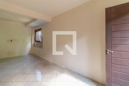 Sala de casa de condomínio para alugar com 1 quarto, 42m² em Vila Nova, Porto Alegre