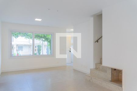 Sala de casa de condomínio à venda com 3 quartos, 155m² em Vila Nova, Porto Alegre