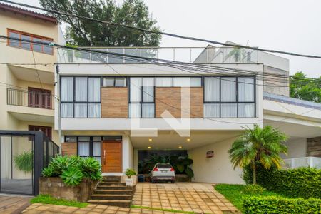 Casa de condomínio à venda com 287m², 3 quartos e 4 vagas Casa de condomínio à venda com 287m², 3 quartos e 4 vagasFachada