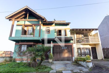 Fachada de casa de condomínio à venda com 3 quartos, 158m² em Jardim Carvalho, Porto Alegre