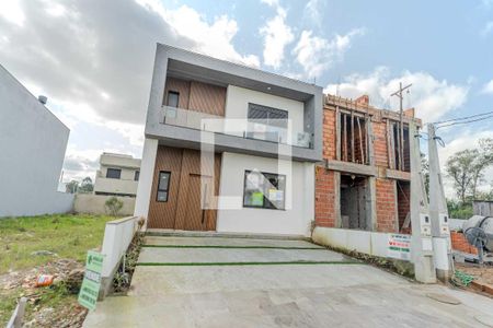 Casa à venda com 77m², 3 quartos e 2 vagas Casa à venda com 77m², 3 quartos e 2 vagasFachada
