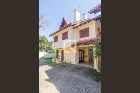 Fachada de casa de condomínio à venda com 3 quartos, 147m² em Espírito Santo, Porto Alegre