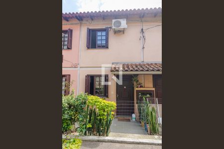 Fachada da casa de casa de condomínio à venda com 2 quartos, 56m² em Vila Nova, Porto Alegre