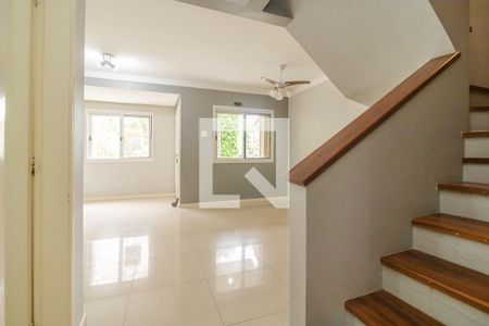 Sala de casa de condomínio à venda com 3 quartos, 144m² em Vila Nova, Porto Alegre