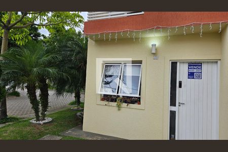 Casa de condomínio à venda com 100m², 2 quartos e 2 vagas Casa de condomínio à venda com 100m², 2 quartos e 2 vagasFachada + Plaquinha