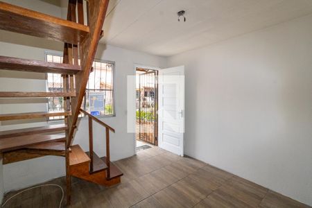 Sala de casa de condomínio à venda com 2 quartos, 50m² em Vila Nova, Porto Alegre