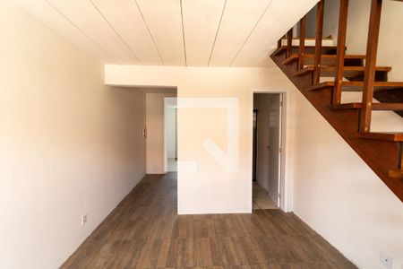 Sala de casa de condomínio à venda com 2 quartos, 50m² em Vila Nova, Porto Alegre