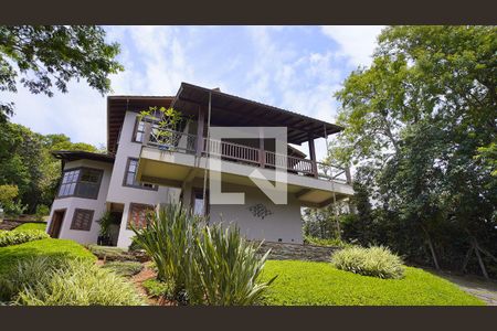 Casa de condomínio para alugar com 380m², 4 quartos e 6 vagasFachada da Casa