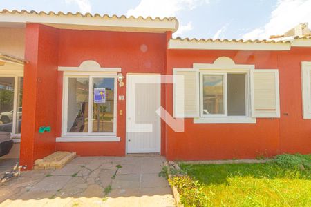 Fachada de casa de condomínio à venda com 3 quartos, 100m² em Rio Branco, Canoas