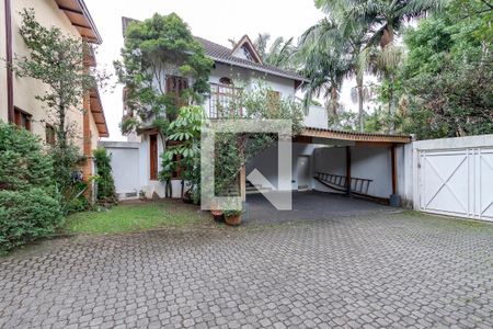 Casa de condomínio à venda com 350m², 4 quartos e 4 vagas Casa de condomínio à venda com 350m², 4 quartos e 4 vagasFachada