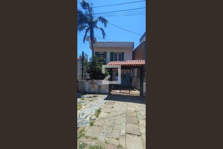 Fachada de casa à venda com 3 quartos, 150m² em Nonoai, Porto Alegre