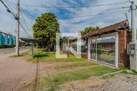 Fachada de casa à venda com 4 quartos, 300m² em Vila Nova, Porto Alegre