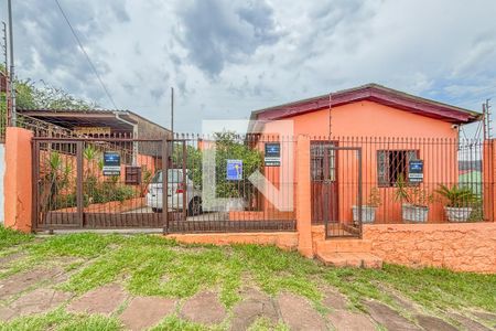 Fachada de casa à venda com 3 quartos, 300m² em Vila Nova, Porto Alegre