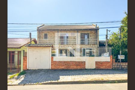Fachada de casa à venda com 4 quartos, 320m² em Vila Nova, Porto Alegre