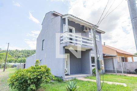 Fachada de casa de condomínio à venda com 3 quartos, 185m² em Aberta dos Morros, Porto Alegre