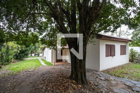 Fachada de casa à venda com 3 quartos, 125m² em Vila Nova, Porto Alegre