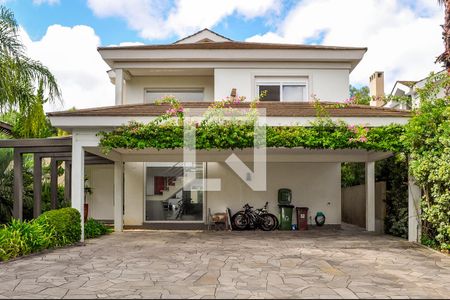 Fachada de casa de condomínio à venda com 5 quartos, 458m² em Pedra Redonda, Porto Alegre