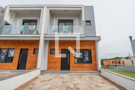 Fachada de casa de condomínio à venda com 3 quartos, 115m² em Aberta dos Morros, Porto Alegre