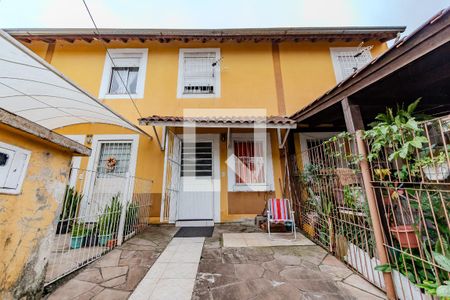 Fachada de casa de condomínio à venda com 2 quartos, 50m² em Aberta dos Morros, Porto Alegre