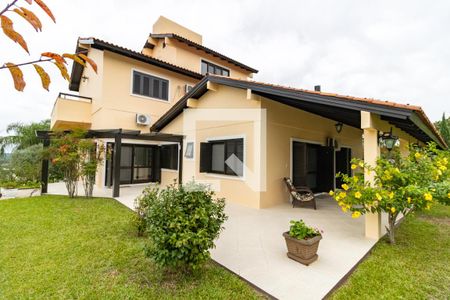 Fachada de casa de condomínio à venda com 4 quartos, 455m² em Hípica, Porto Alegre