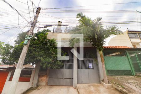 Fachada de casa à venda com 3 quartos, 180m² em Mário Quintana, Porto Alegre