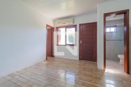 Sala de casa de condomínio para alugar com 1 quarto, 32m² em Vila Nova, Porto Alegre