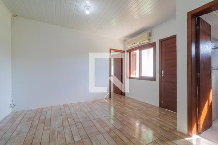 Sala de casa de condomínio para alugar com 1 quarto, 32m² em Vila Nova, Porto Alegre