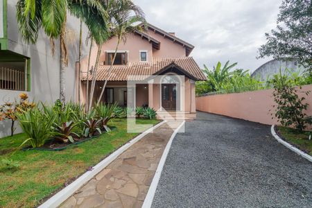 Fachada de casa à venda com 5 quartos, 378m² em Vila Nova, Porto Alegre