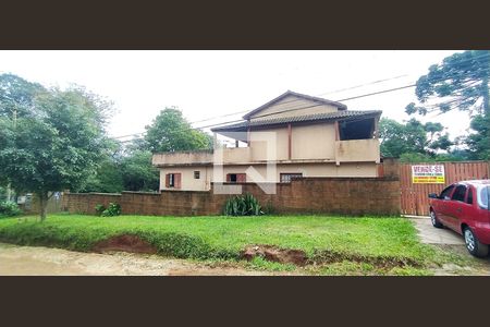 Fachada de casa à venda com 3 quartos, 500m² em Campo Novo, Porto Alegre
