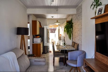 Sala de casa de condomínio à venda com 2 quartos, 49m² em Campo Novo, Porto Alegre