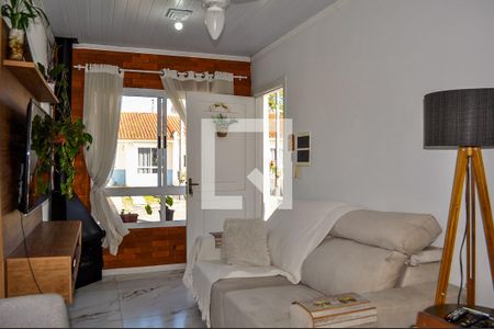 Sala de casa de condomínio à venda com 2 quartos, 49m² em Campo Novo, Porto Alegre