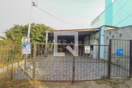 Fachada e placa de casa à venda com 4 quartos, 65m² em Rubem Berta, Porto Alegre