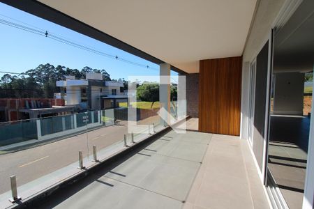 Sacada da sala de casa de condomínio à venda com 4 quartos, 356m² em Vila Nova, Porto Alegre