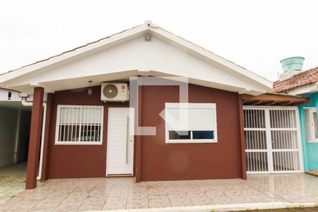 Fachada de casa de condomínio à venda com 2 quartos, 72m² em Harmonia, Canoas