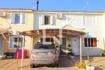 Fachada de casa de condomínio à venda com 3 quartos, 100m² em Rio Branco, Canoas