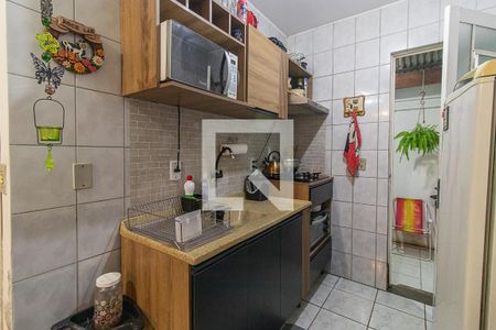 Cozinha e Área de Serviço de casa de condomínio à venda com 2 quartos, 56m² em Vila Nova, Porto Alegre