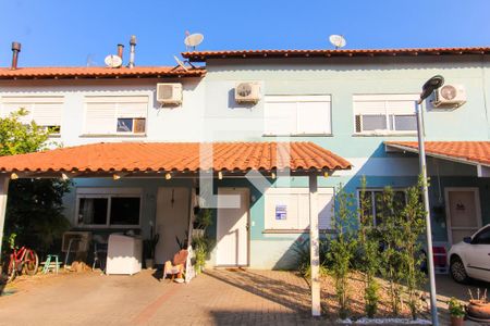Fachada de casa de condomínio à venda com 2 quartos, 84m² em Fátima, Canoas