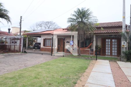 Fachada de casa à venda com 3 quartos, 200m² em Harmonia, Canoas