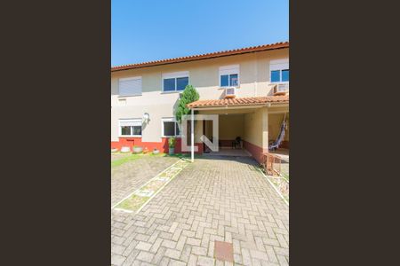 Fachada de casa de condomínio à venda com 3 quartos, 100m² em Harmonia, Canoas