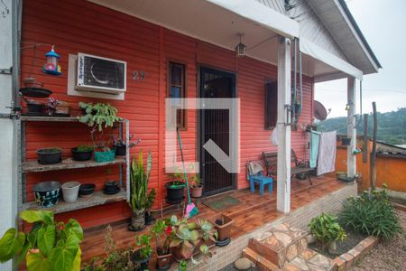Fachada de casa à venda com 3 quartos, 180m² em Vila Nova, Porto Alegre