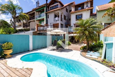 Piscina de casa à venda com 3 quartos, 154m² em Campo Novo, Porto Alegre