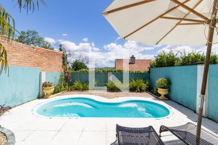 Piscina de casa à venda com 3 quartos, 154m² em Campo Novo, Porto Alegre