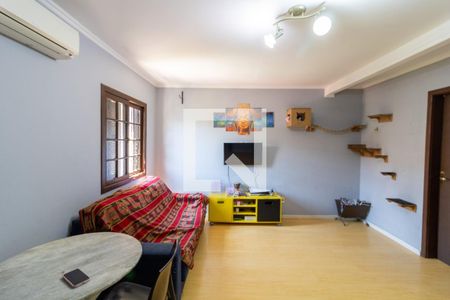 Sala de casa de condomínio à venda com 3 quartos, 90m² em Vila Nova, Porto Alegre