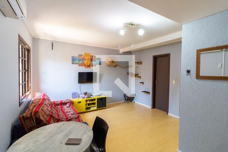 Sala de casa de condomínio à venda com 3 quartos, 90m² em Vila Nova, Porto Alegre