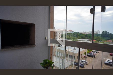 Varanda e churrasqueira  de apartamento à venda com 2 quartos, 55m² em Vila Nova, Porto Alegre