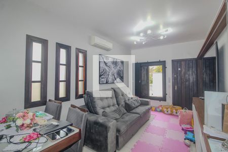 Sala de casa de condomínio para alugar com 3 quartos, 144m² em Vila Nova, Porto Alegre