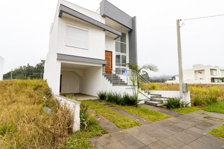 Casa à venda com 165m², 3 quartos e 2 vagas Casa à venda com 165m², 3 quartos e 2 vagasFachada